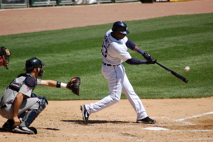 Hitting a baseball.