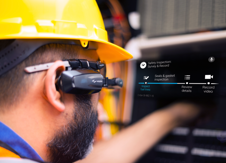 Worker wearing Vuzix smart glasses.