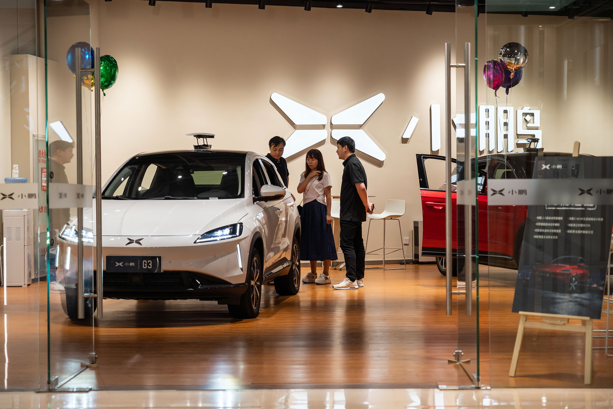 Customers experiencing a new car at the Chinese automobile