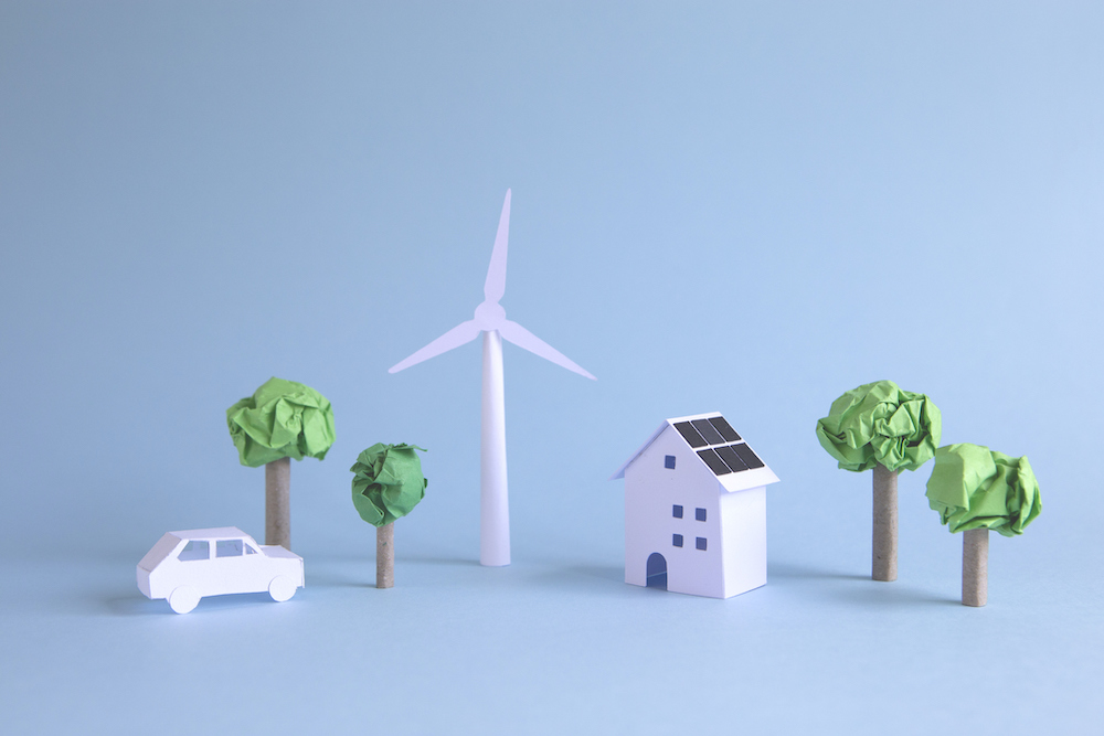 Ideal paper world powered with alternative wind and solar energy. environmental concept.